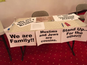 A table with signs on it that say " we are family ".